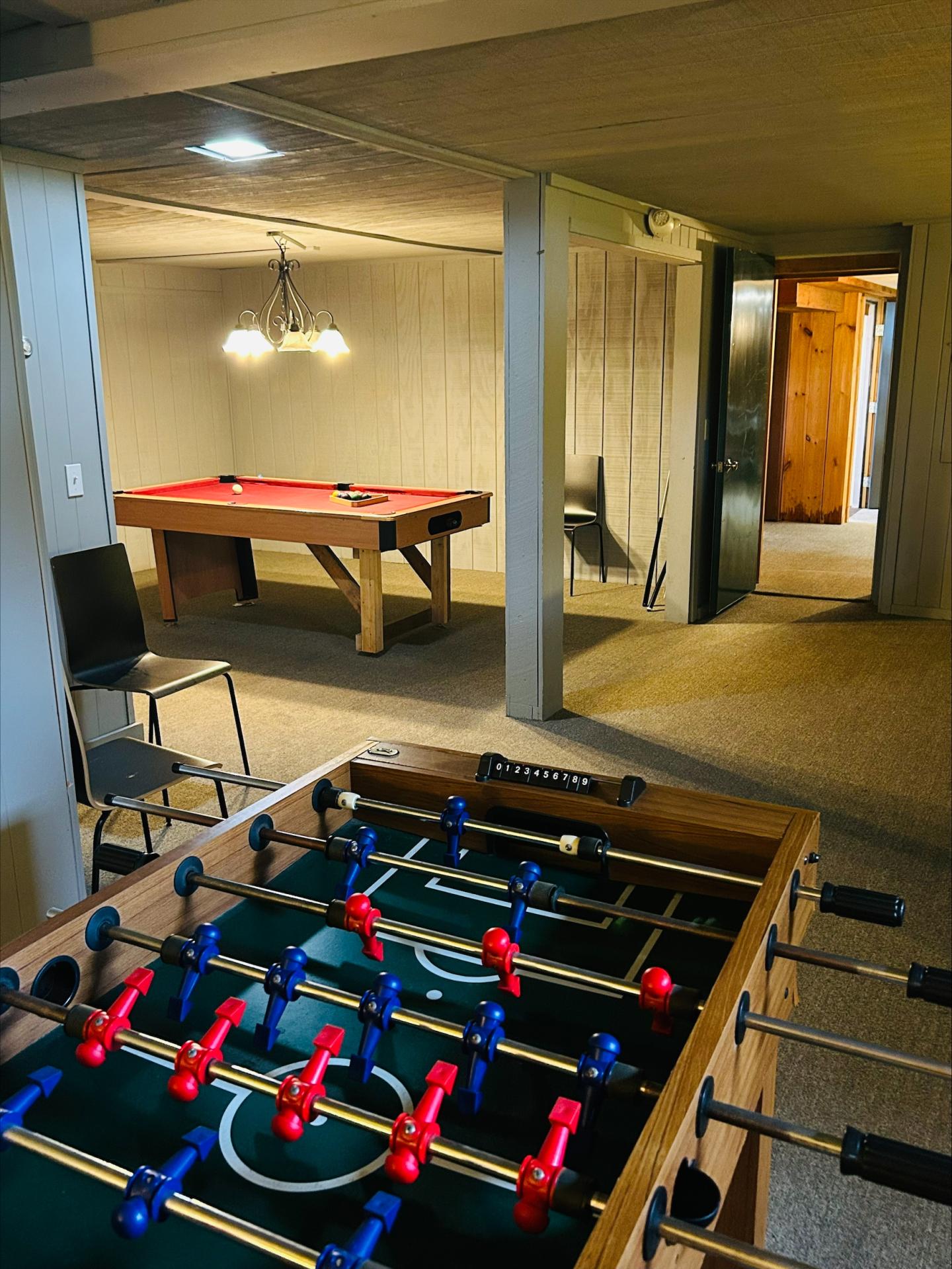 Stowe Motel game room with pool table and foosball
