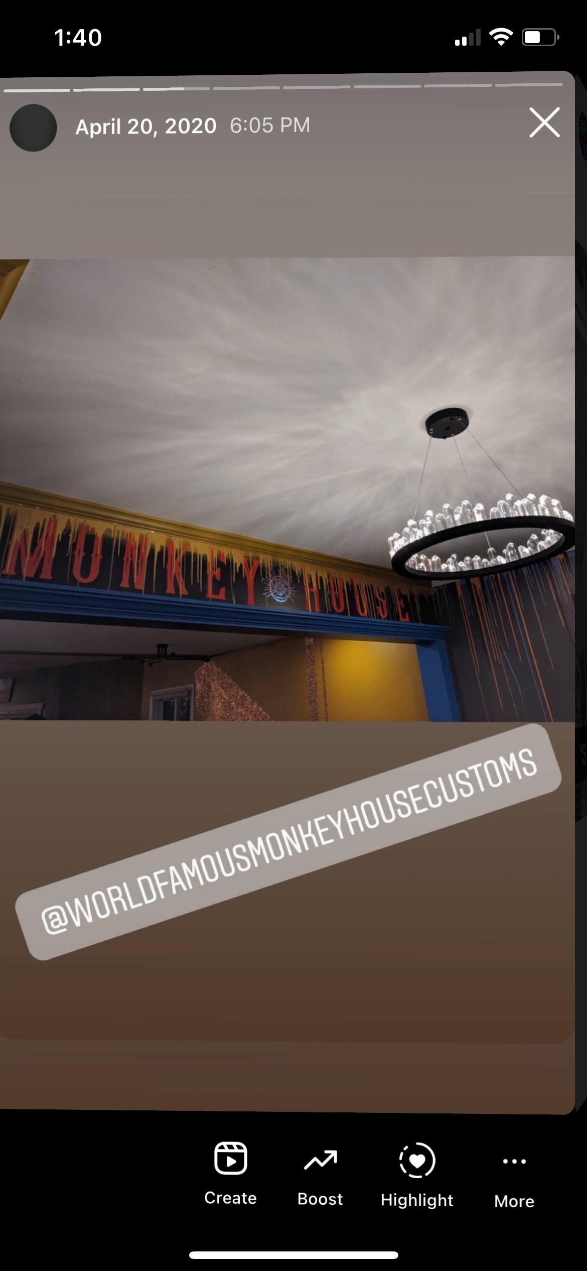 Circular chandelier on a ceiling with colorful wall borders.