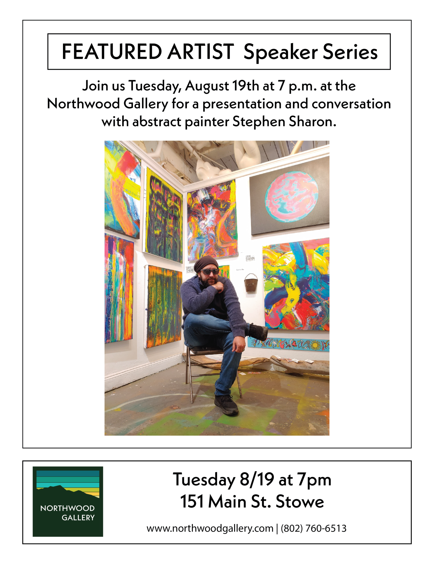 Artist sitting in a colorful gallery with abstract paintings.