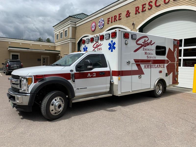 Ambulance parked outside a fire and rescue station.