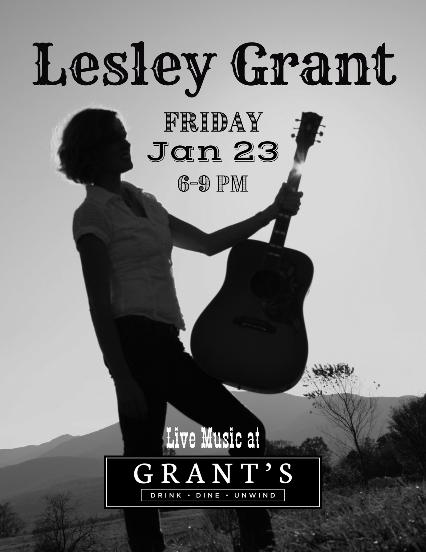 Silhouette of woman with guitar in a landscape setting.