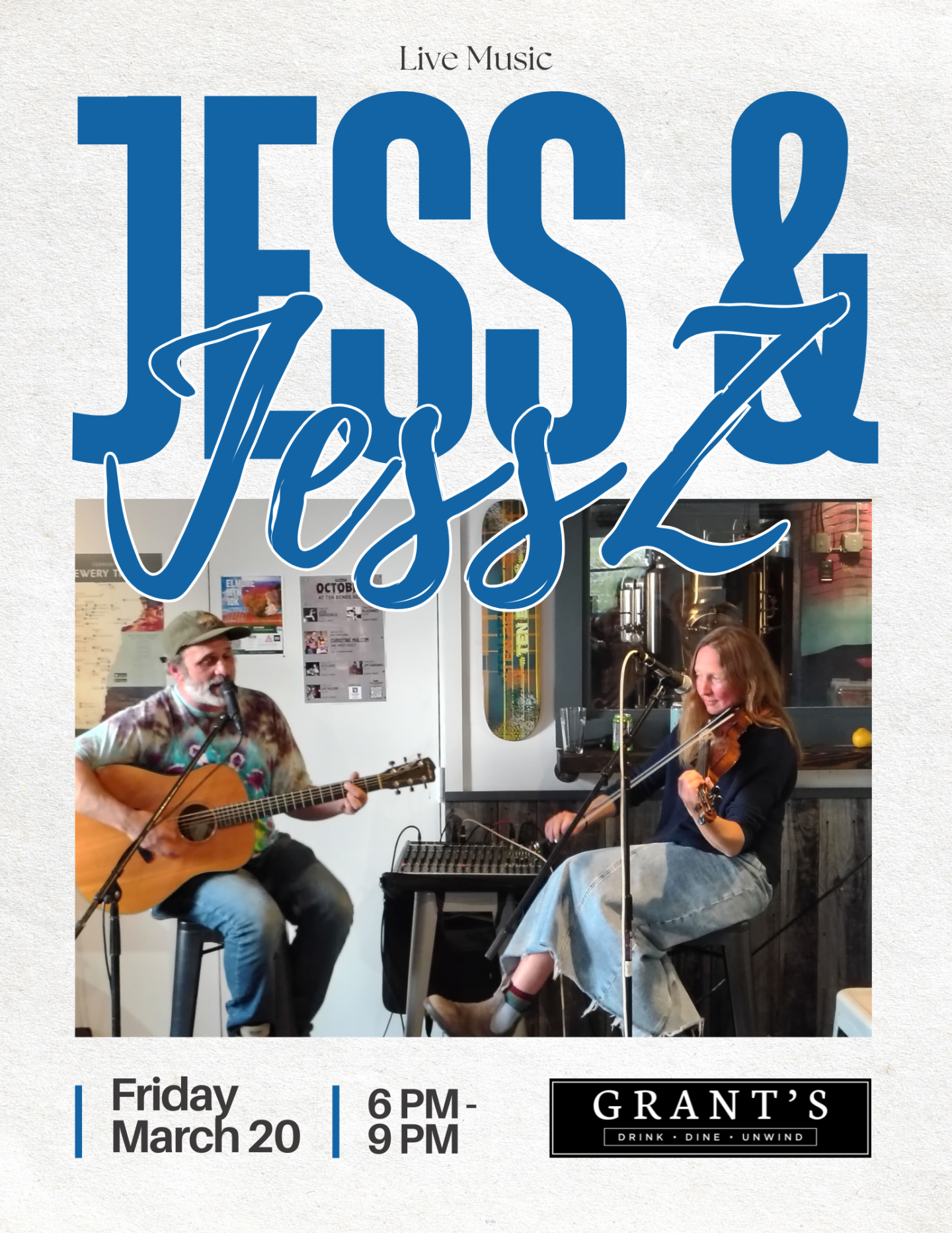 Musicians playing guitar and violin in a cozy setting.