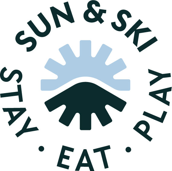 Sun & Ski logo with stylized sun, mountain, and snowflake.