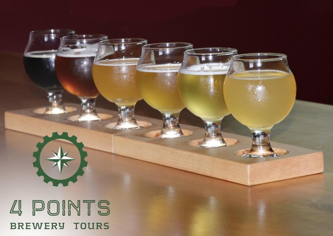 Beer flight with six glasses of varying colors on a wooden tray. Logo of 4 Points Brewery Tours.
